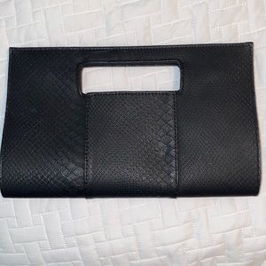 Charming Charlie’s black snakeskin clutch. 12.5 x 8 x 4